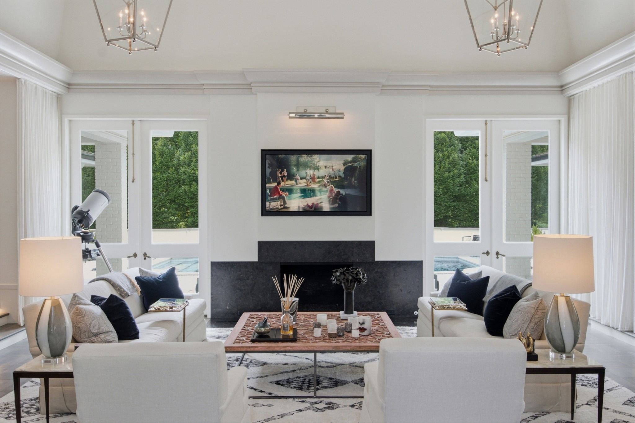 Living room with a fireplace, white walls and tall windows at 109 Westhampton Place in Belle Meade Nashville