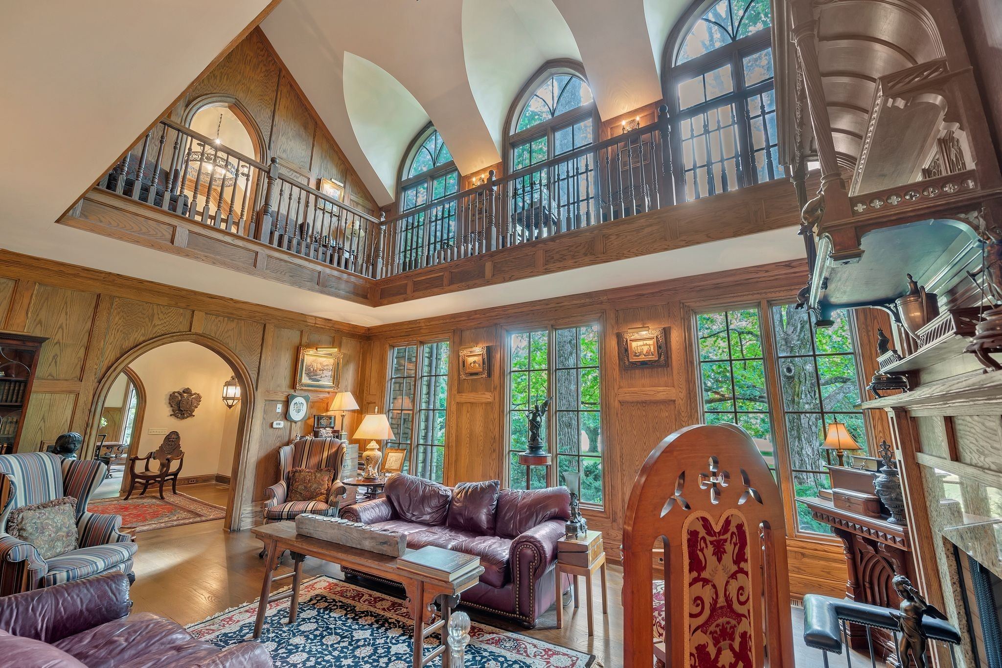 Great room with tall arched windows and a balcony overlook at 1108 Belle Meade Boulevard in Belle Meade Nashville