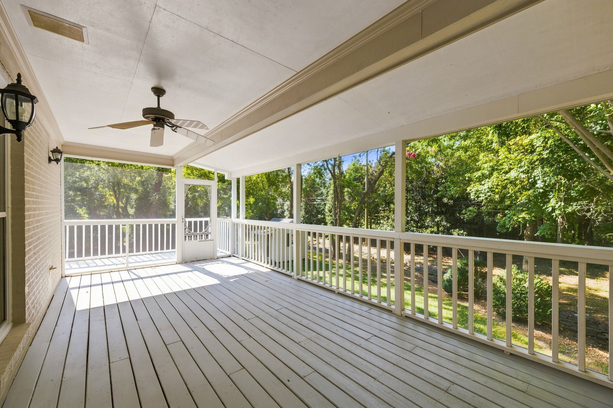 Covered porch overlooking the wooded back yard at 317 Sutherland Avenue in Belle Meade Nashville