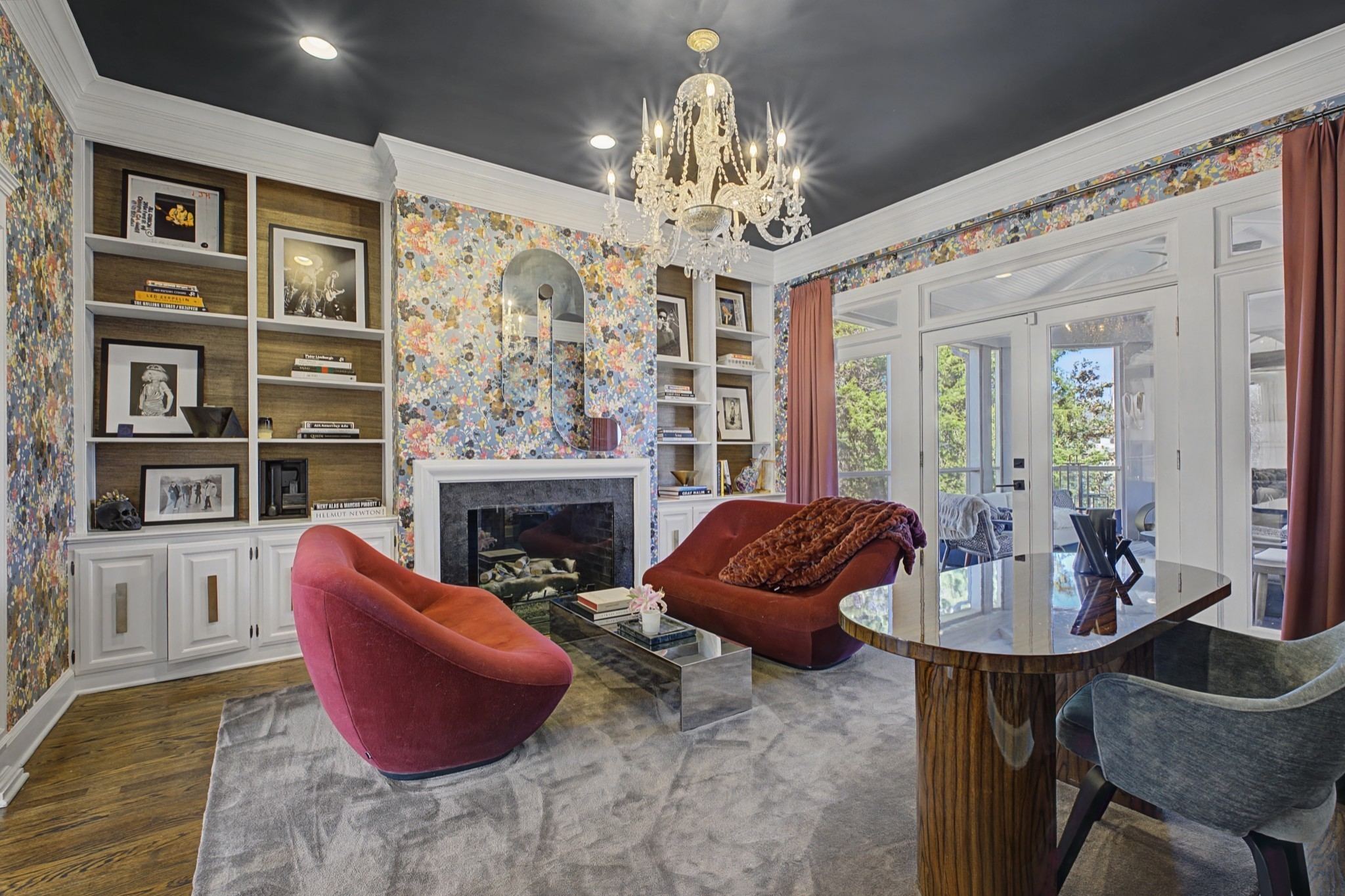 Living room with a fireplace, built in shelves and a chandelier at 4304 Warner Place in Belle Meade Nashville