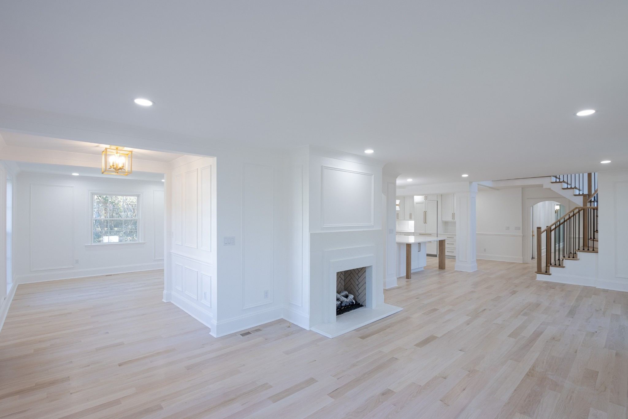 Open living area with a fireplace and light wood floors at 4401 Iroquois Avenue in Belle Meade Nashville